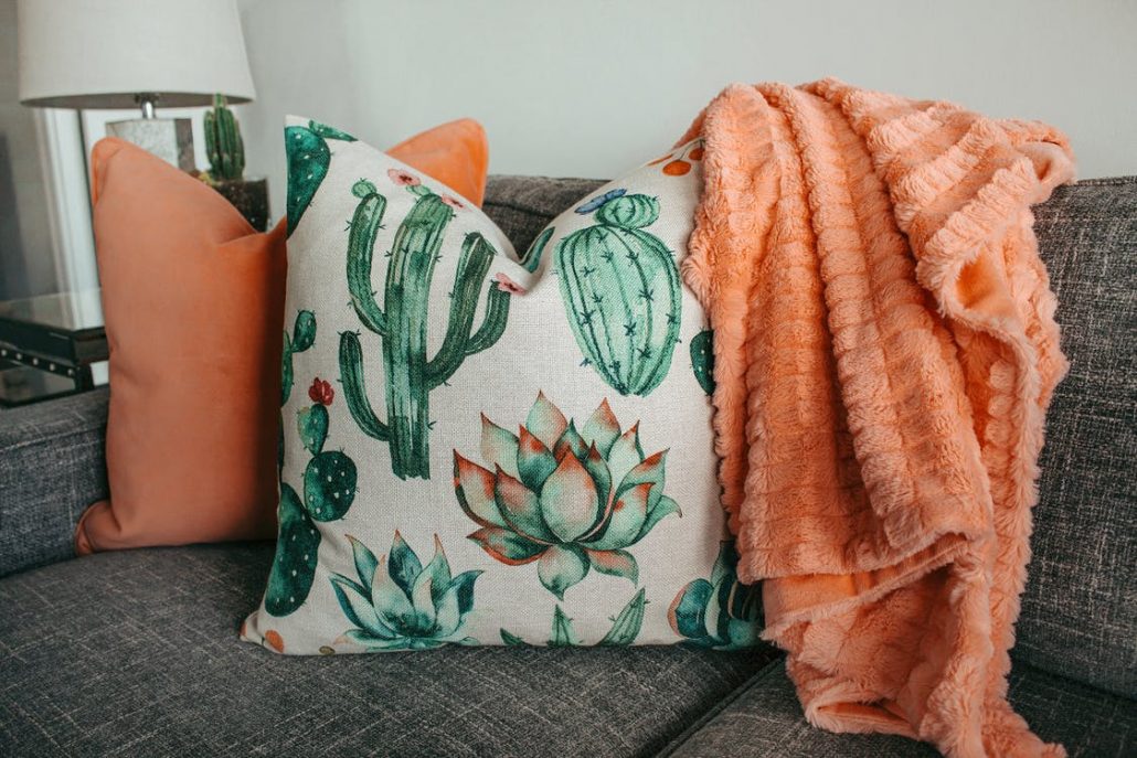 plants inspired pillows in a couch in basement renovation