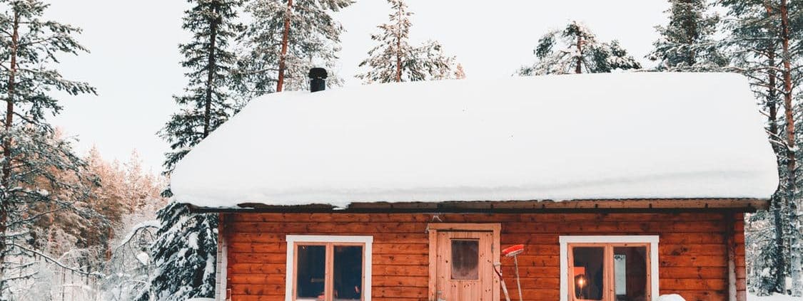 Charming Hamilton log cabin on snowy Winter day