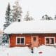 Charming Hamilton log cabin on snowy Winter day
