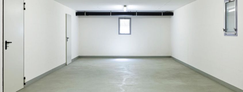 Large, blank room in unused basement of Hamilton home